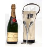 Moet Champagne nv in Moet cool bag with two Moet glasses on Moet stand