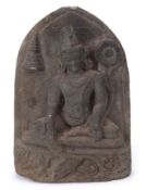 Indo-Javanese model of a Hindu deity, on a stoneware base with a domed stoneware background, 32cm