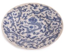 Large Chinese blue and white charger decorated with two horned scaly dragons chasing the flaming