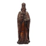 Antique carved oak regal figure wearing a coronet and with raised right hand, circa 16th/17th