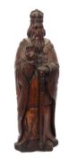 Antique carved oak regal figure wearing a coronet and with raised right hand, circa 16th/17th