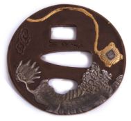 Japanese iron Tsuba signed by Yuzen, circa 1830-1840, decorated in gold and white metal on bronze