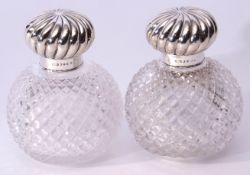 Large pair of late Victorian spherical hobnail cut glass scent decanters with wrythen embossed screw