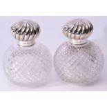 Large pair of late Victorian spherical hobnail cut glass scent decanters with wrythen embossed screw