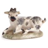 18th century miniature model of a goat on a flat leafy green base, possibly Chelsea or Bow, 7cm
