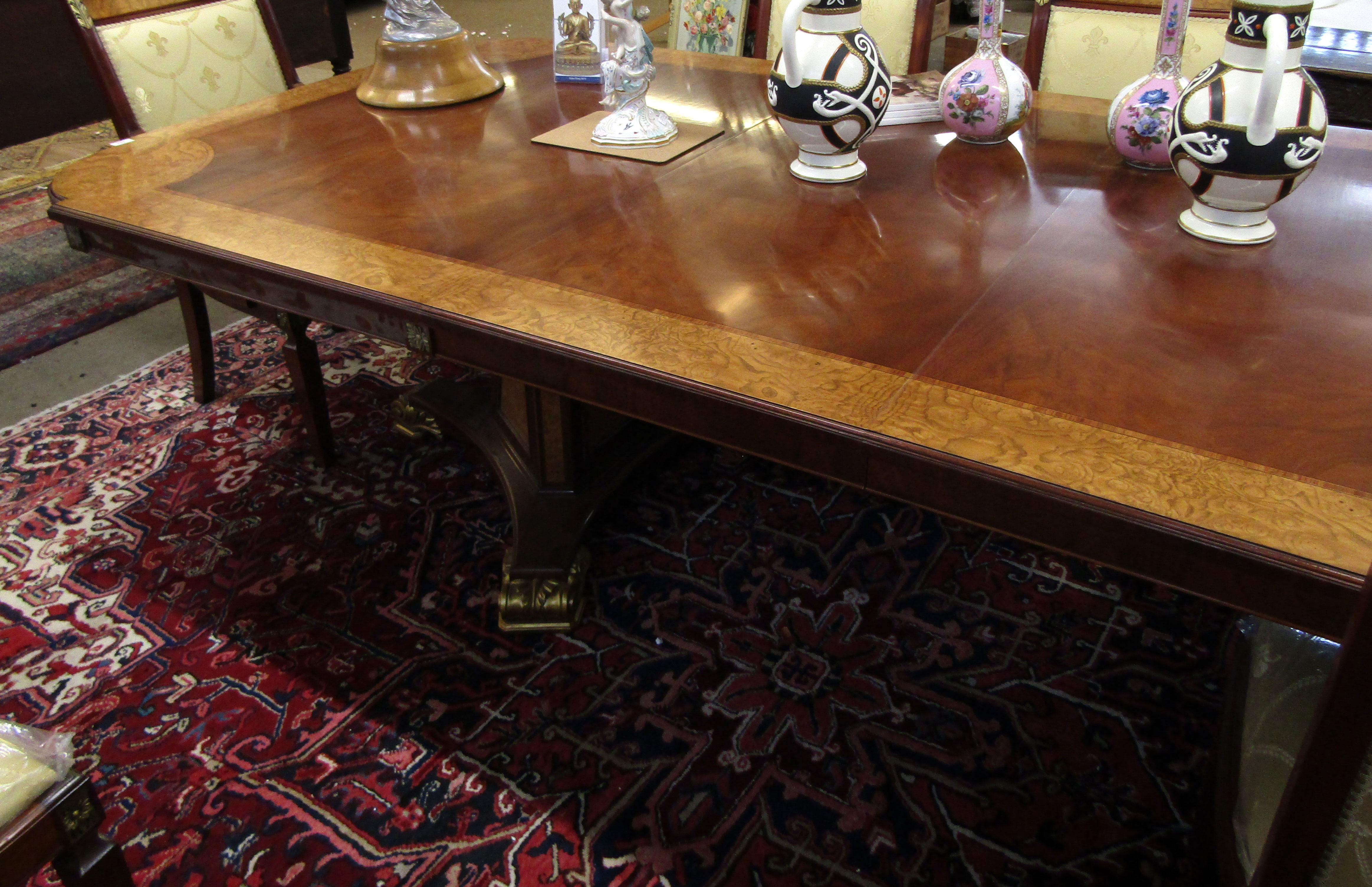 Good reproduction walnut and mahogany twin pedestal extending dining table of rectangular form