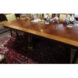 Good reproduction walnut and mahogany twin pedestal extending dining table of rectangular form
