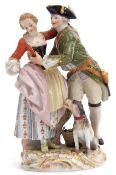 19th century Meissen group of a pair of lovers with a dog by their side on gilt scroll base, blue