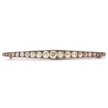 Art Deco diamond set bar brooch, elongated design, featuring 21 graduated old cut diamonds, each
