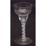Mid-18th century wine glass with double ogee bowl above a double series air twist stem, 16cm high