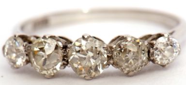 Precious metal five stone diamond ring featuring five graduated old cut diamonds, total carat weight