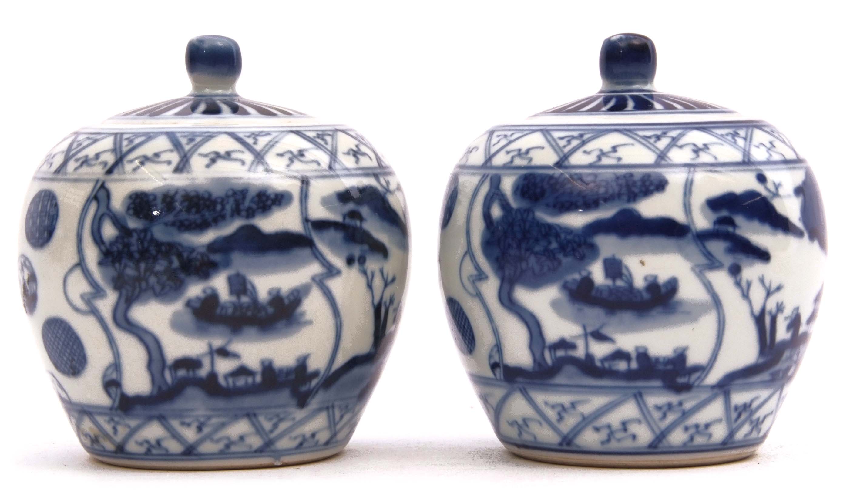 Two Chinese jars with covers, decorated with a blue and white design, six character mark to base,