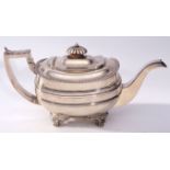 Late George III tea pot of compressed rectangular form, having straight gadrooned rim, fluted finial