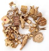9ct gold box and circular link bracelet suspending various 9ct gold charms including a harp, a bird,