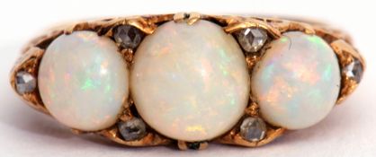 Antique opal and diamond ring featuring three graduated circle cabochon opals interspersed by six