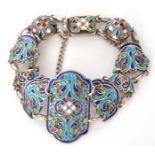 Russian silver and enamel bracelet, each panel decorated with translucent coloured enamels and