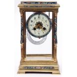 Last quarter of 19th/first quarter of 20th century four glass clock with striking movement on a