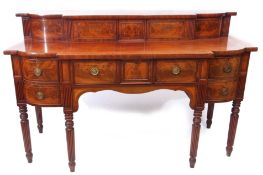 Regency period mahogany serving table of break front form, the pediment inset with sliding door