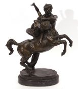 Bronze patinated classical study of centaur and maiden, the base marked "Debut" on a black marble