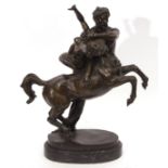 Bronze patinated classical study of centaur and maiden, the base marked "Debut" on a black marble