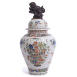 Large Chinese porcelain famille vert jar and cover with dog of fo finial and decoration of flowers