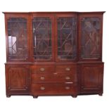 Late Georgian mahogany break front library bookcase, the top with moulded cornice above two bow