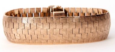 Late 20th century 9ct gold articulated bracelet, rose coloured, of textured design, 210mm long x