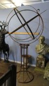 Modern weathered cast metal globe shaped pedestal weather vane with central arrow pointer, 202cm