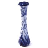Moorcroft Florian ware vase, the slender body decorated with a floral and leaf design, Florian