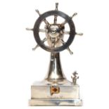 George VI novelty silver encased table lighter in the form of a rotating ship's wheel and capstan on