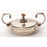 George V circular table lighter with two flying scroll handles, engraved with initial 'B', 8cm diam,