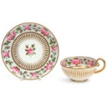 Early 19th century cabinet cup and saucer, the exterior with a gilt design, the interior with a