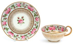 Early 19th century cabinet cup and saucer, the exterior with a gilt design, the interior with a