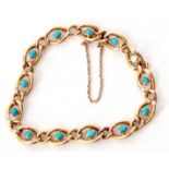 15ct stamped turquoise set curb link bracelet, the 13 open work links each centring an oval cabochon