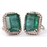 Pair of modern emerald and diamond cluster stud earrings, the octagon shaped earrings surrounded