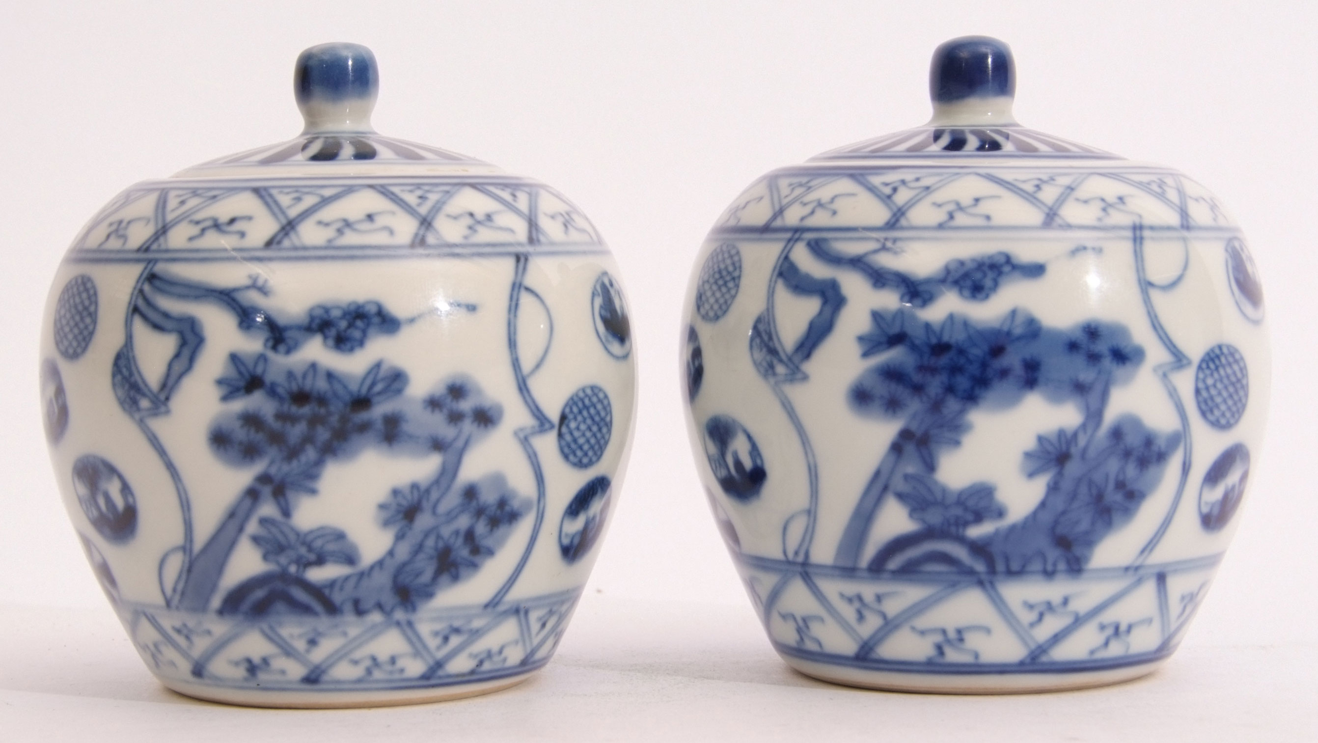 Two Chinese jars with covers, decorated with a blue and white design, six character mark to base, - Image 4 of 6