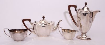 George V four piece tea set of panelled oval design comprising tea pot, hot water jug, two handled