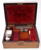 Victorian rosewood and brass mounted travelling vanity set, the interior part fitted with four