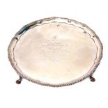 George III circular salver with cast and applied wrythen gadrooned border and mounted on four cast