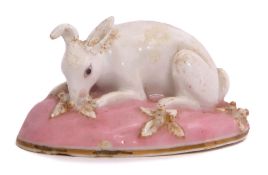 Chamberlain Worcester model of a rabbit seated on a pink flower encrusted base, 7cm long