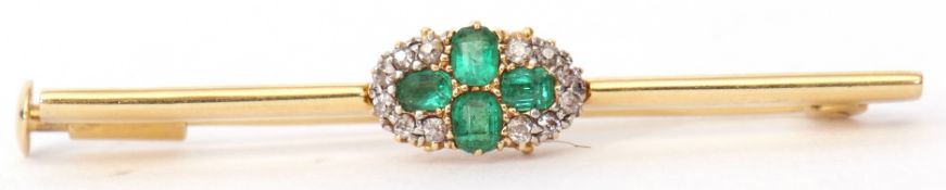 Emerald and diamond cluster bar brooch, the oval shaped centre with four small oval emeralds