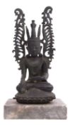 Oriental bronze figure of Buddha on a stone base, 35cm high