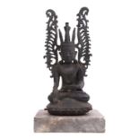 Oriental bronze figure of Buddha on a stone base, 35cm high