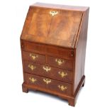 18th century style walnut bureau of small proportions, the cross banded top and fall front enclosing