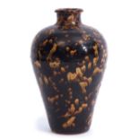 Jizhou ware vase the baluster body decorated in typical fashion with a sponged buff effect on