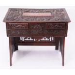 Oriental hardwood centre table, the top ornately carved with dragons, bats and hieroglyphics