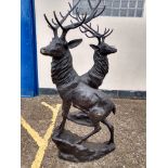 Two bronze patinated cast metal studies of stags, modern, 200cm high