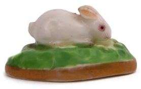 English porcelain miniature figure of a rabbit on a green base