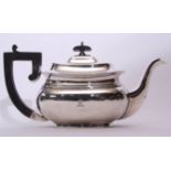 George V tea pot of compressed oval form, having ebonised handle and finial, (minor defects