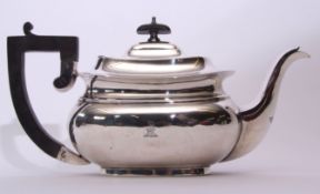 George V tea pot of compressed oval form, having ebonised handle and finial, (minor defects